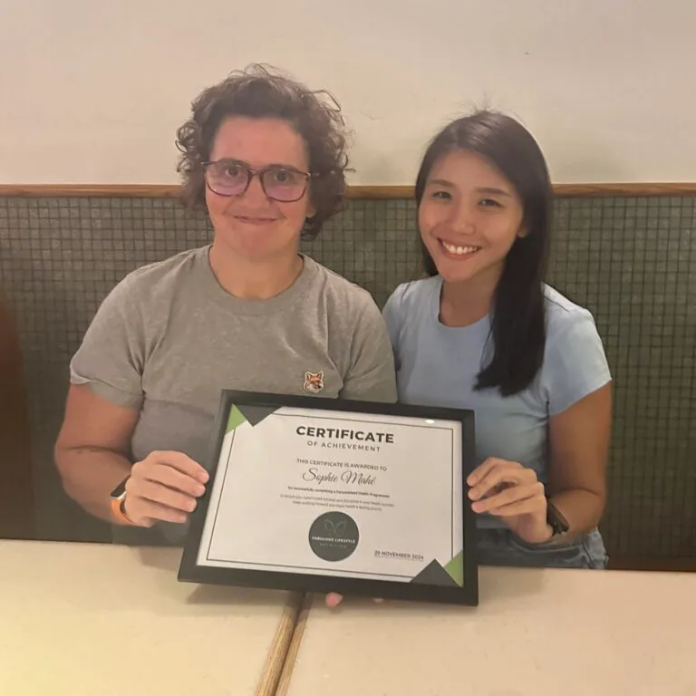coach and female client with certificate